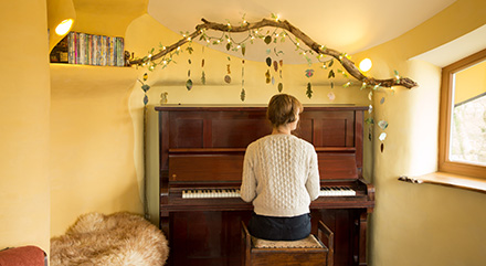 piano at mud and wood house